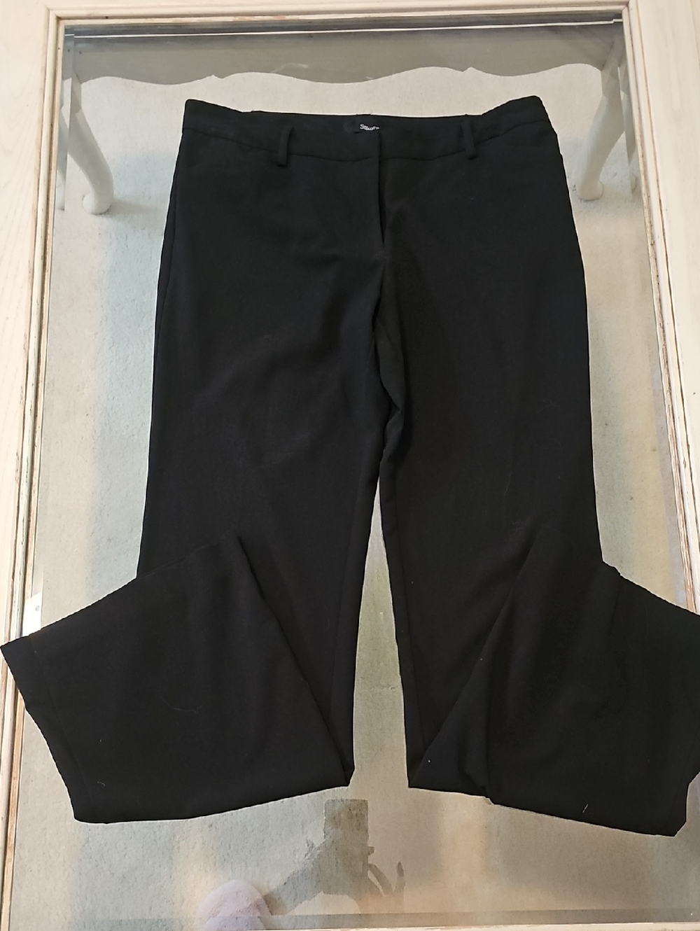 Starcity Black Boot-Cut Dress Pants. Smooth fabric with a tailored silhouette.